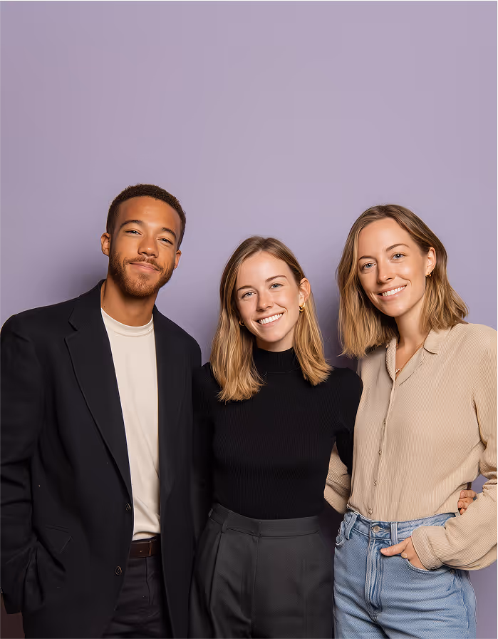 Three professionals standing together, representing a recruiting team.