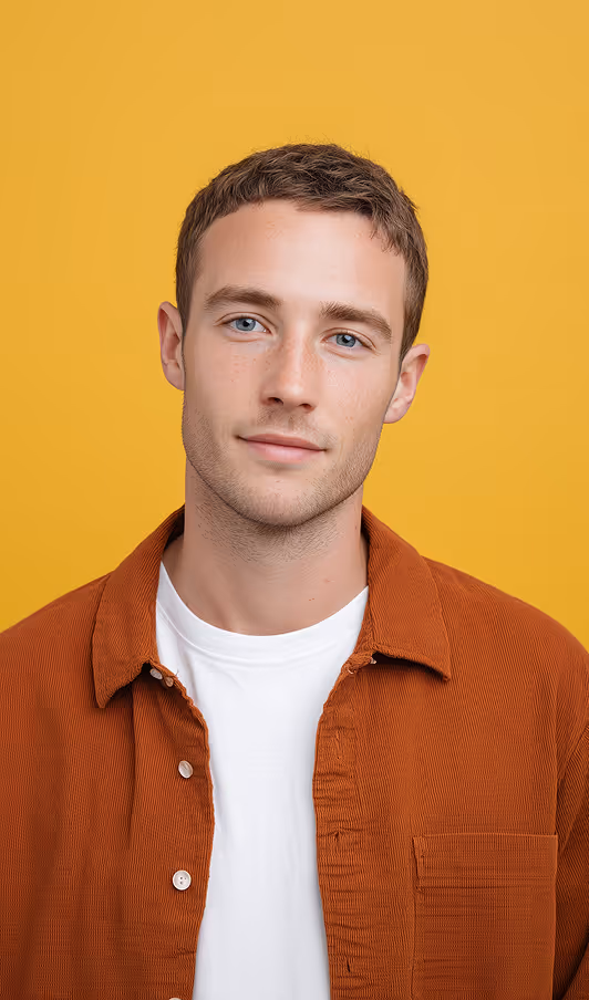 A casually dressed man smiling, representing a candidate on a TalentFolia shortlist.